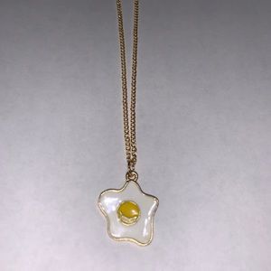 Egg pendant necklace with gold chain